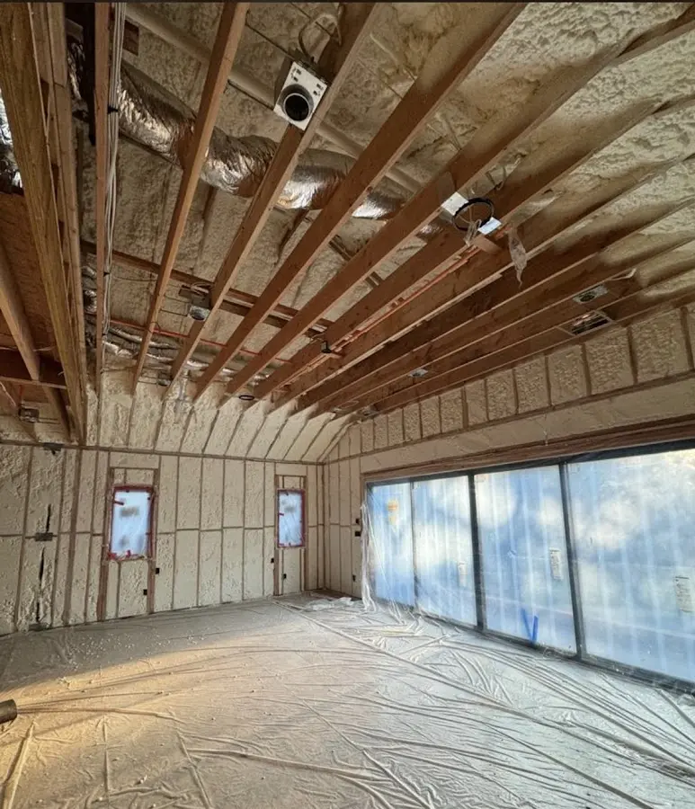 Interior walls and ceiling insulated with spray foam during new construction in Ave Maria